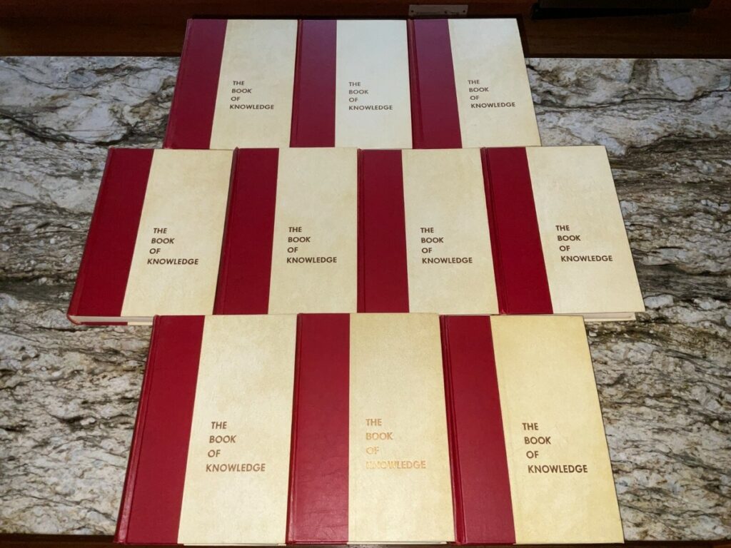 Rockford Public Schools Board candidate Josh Hall sharing childhood reading stories with an old set of encyclopedias.